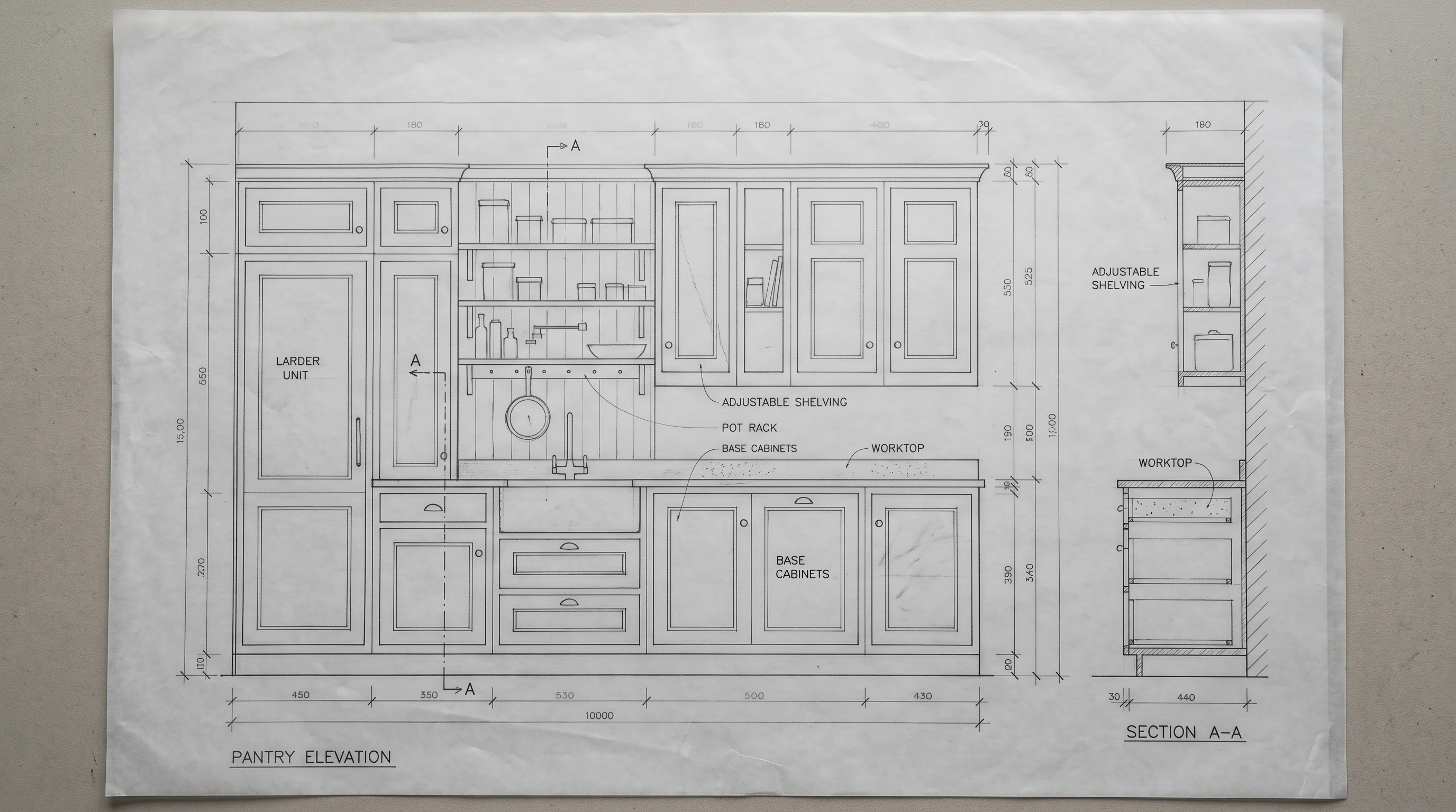 Pencil elevation of a pantry kitchen at 1:20 on trace paper, with dimension lines, graphite hatching and a drafted title block